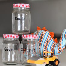 Load image into Gallery viewer, Three jars with "Smile", "Give" and "Splurge" labelled with a soft toy dinosaur and truck next to them