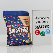 Load image into Gallery viewer, Ivory tin with black vinyl label and three smiley faces in red, blue and green - Because of you I'm a smartie with a picture of the tin with a packet of smartie chocolates