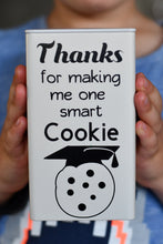 Load image into Gallery viewer, Ivory tin with black vinyl label - Thanks for making me one smart cookie with a picture of a child holding the tin