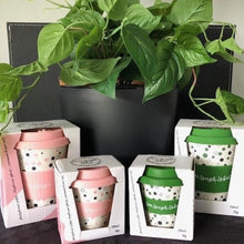 Load image into Gallery viewer, 2 large keep cups and 2 matching small keep cups with a green plant in the background